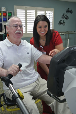 elderly man working out on an exercise bike